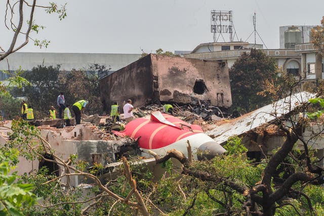 <p>Investigators examine the wreckage of the crashed Air India plane in Ahmedabad</p>