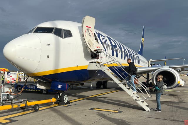 <p>Going places: Passengers preparing for a Ryanair flight from its main base, London Stansted to Baden-Baden in Germany</p>