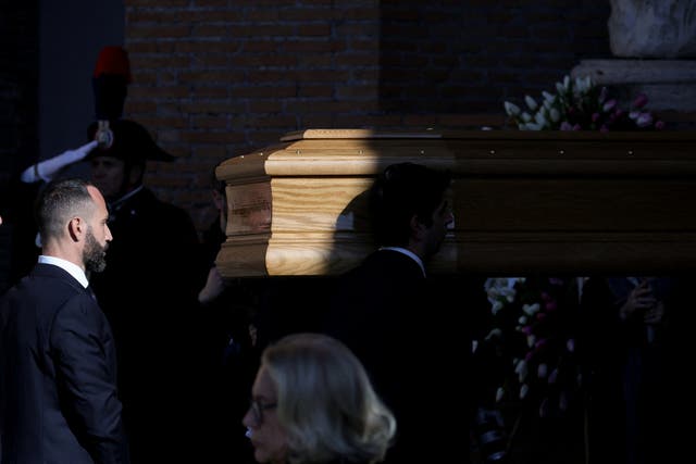 <p>Pallbearers carry the coffin of fashion designer Valentino Garavani, who died at the age of 93, to the Basilica of Saint Mary of the Angels and Martyrs for the funeral ceremony in Rome, Italy</p>